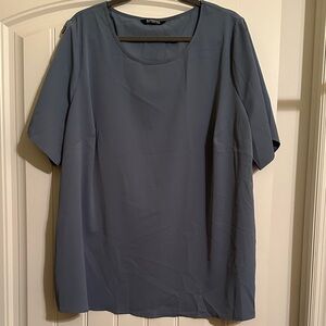 Size 18-20 BloomChic Slate Blue Top. Wooden buttons on sleeves. 100% polyester.